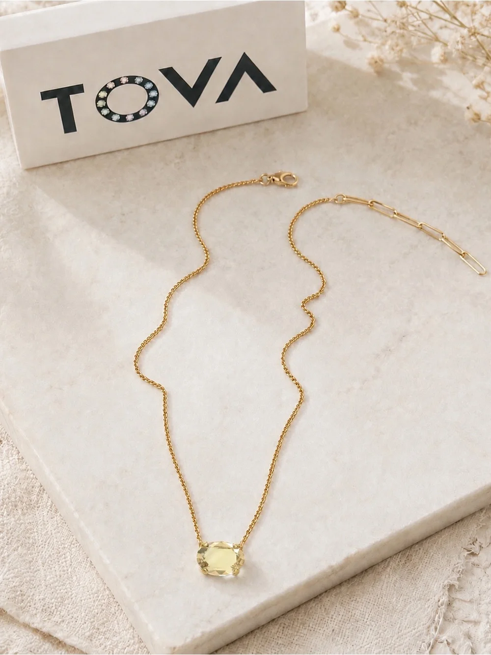 TOVA IZA golden shadow pendant on a gold Chain Necklace.